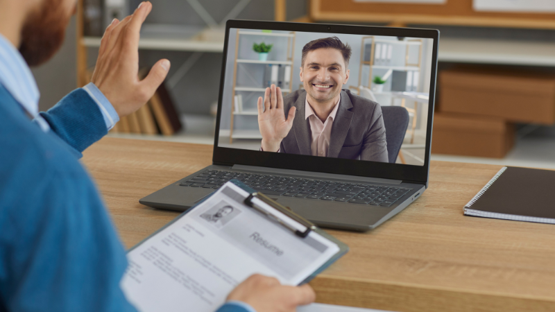 A man using a laptop for a video call.