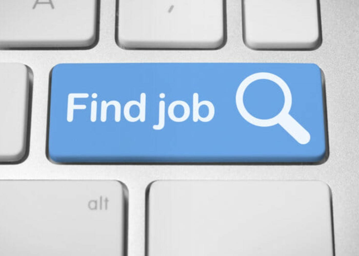 A computer keyboard with a button highlighted in blue that reads "Job Search"