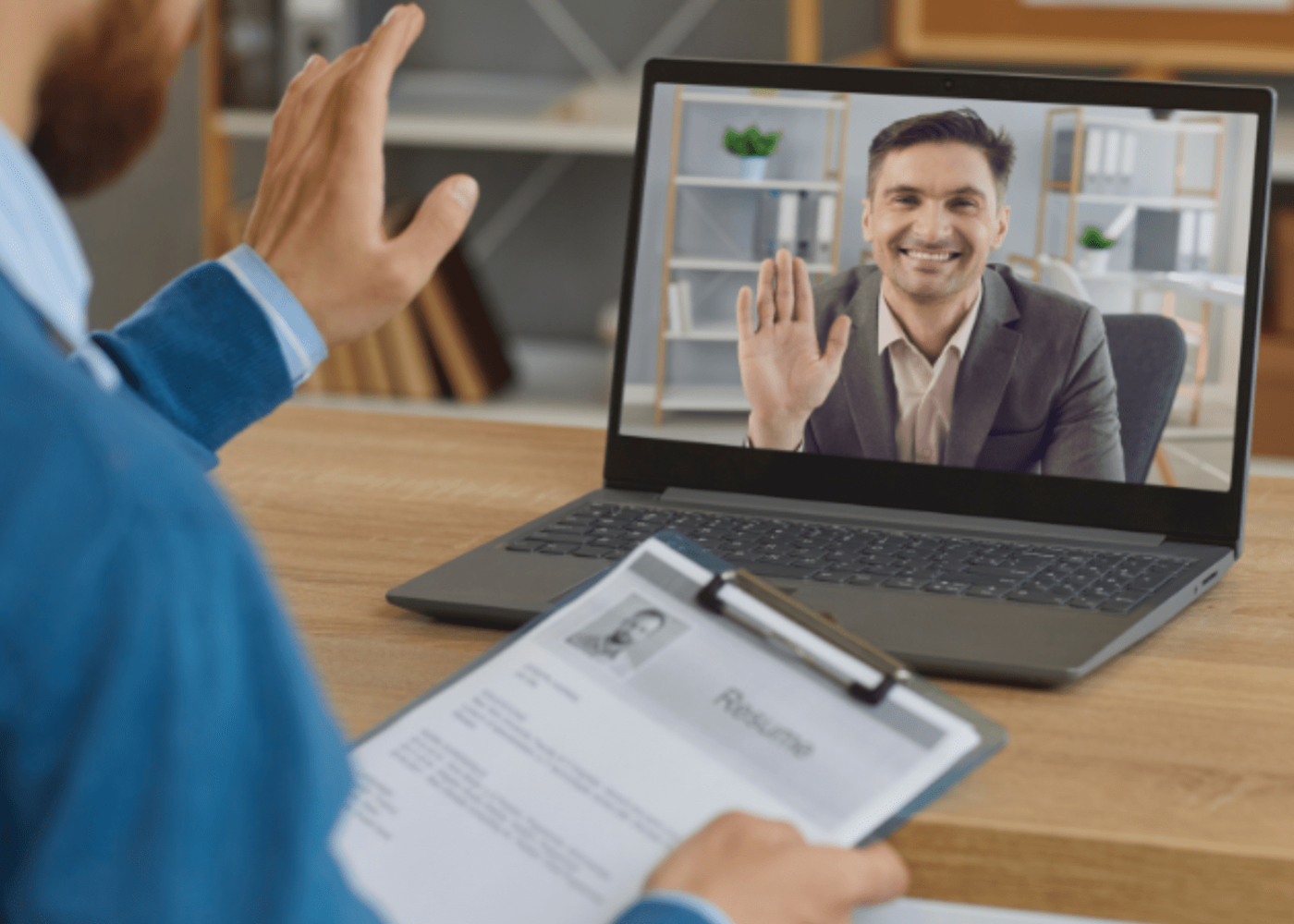 A virtual interview with two businessmen on a laptop