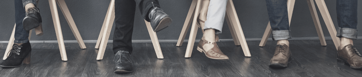 A diverse set of business professionals sitting in a row